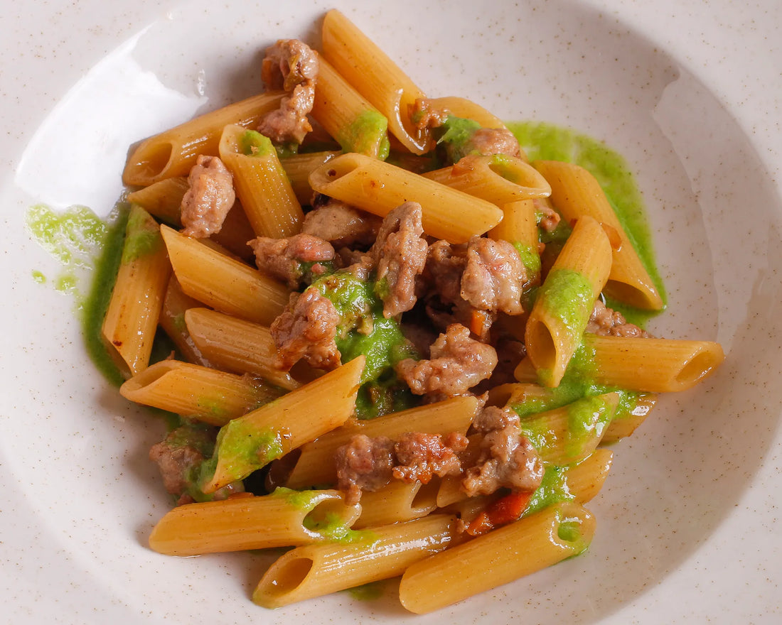 Penne al ragù bianco di salsiccia e riduzione di cicoria