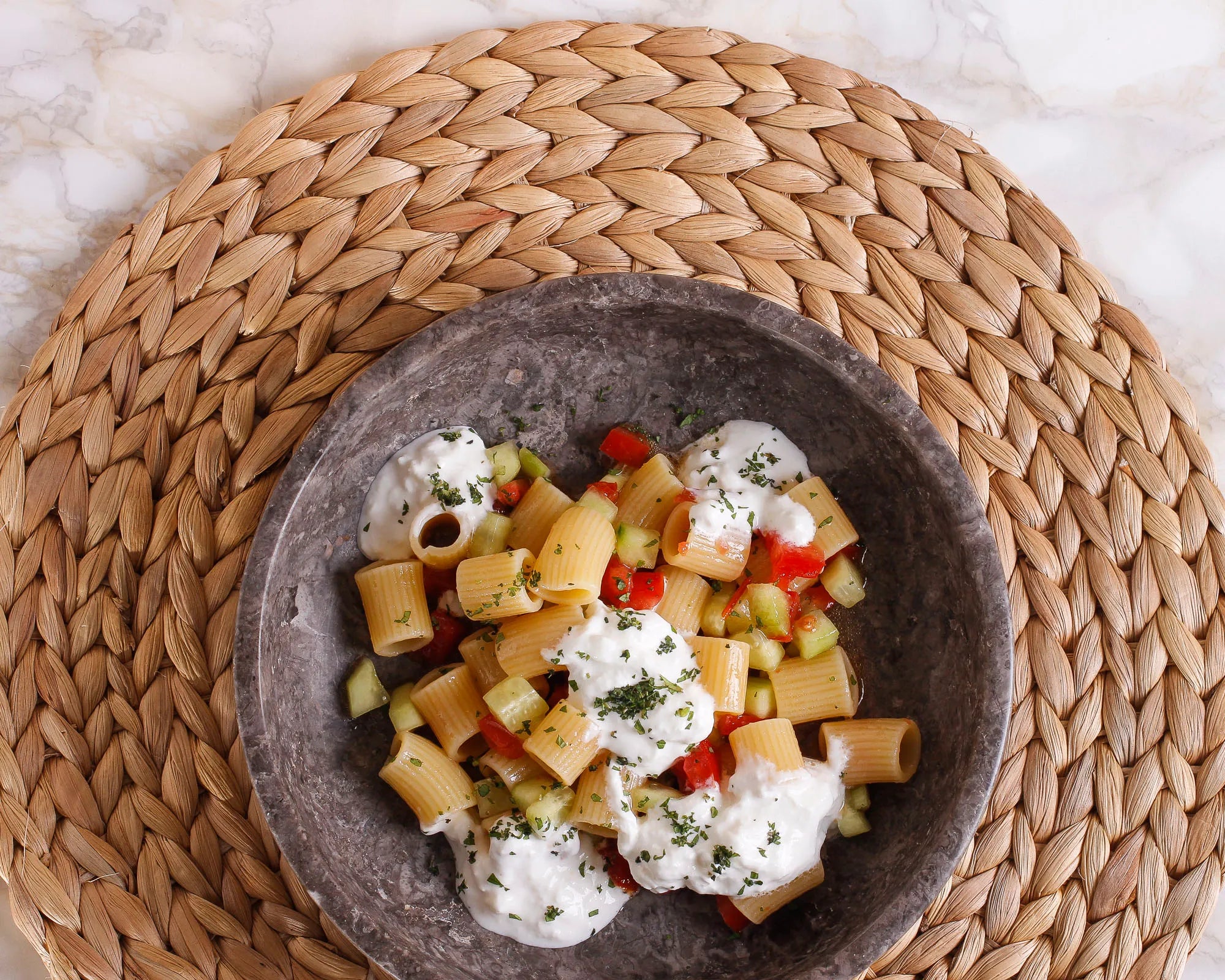 Pasta salad with concassé tomatoes, cucumber, mint, and burrata 