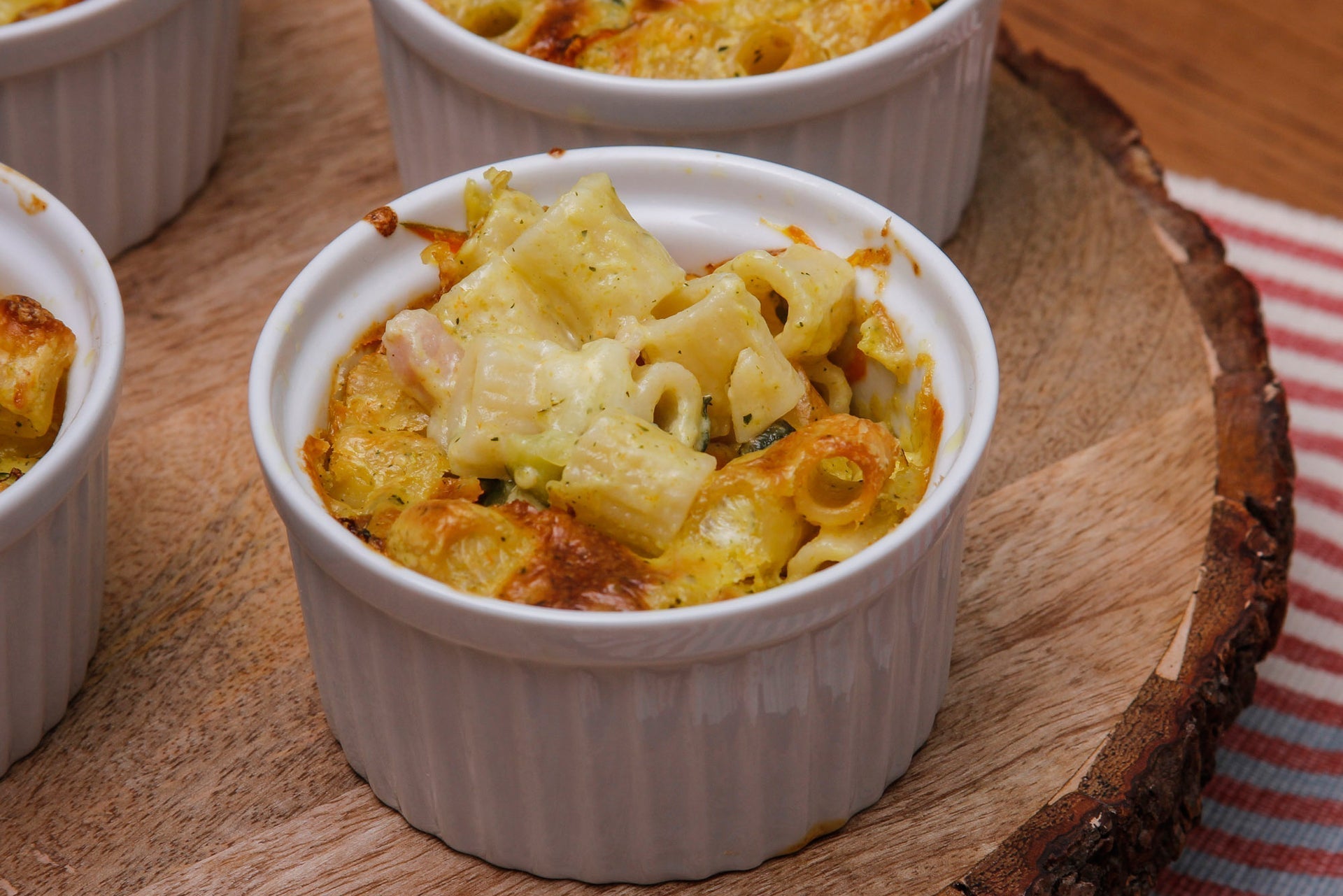 Zucchini and courgette flower pasta soufflés with pancetta and mozzarella 